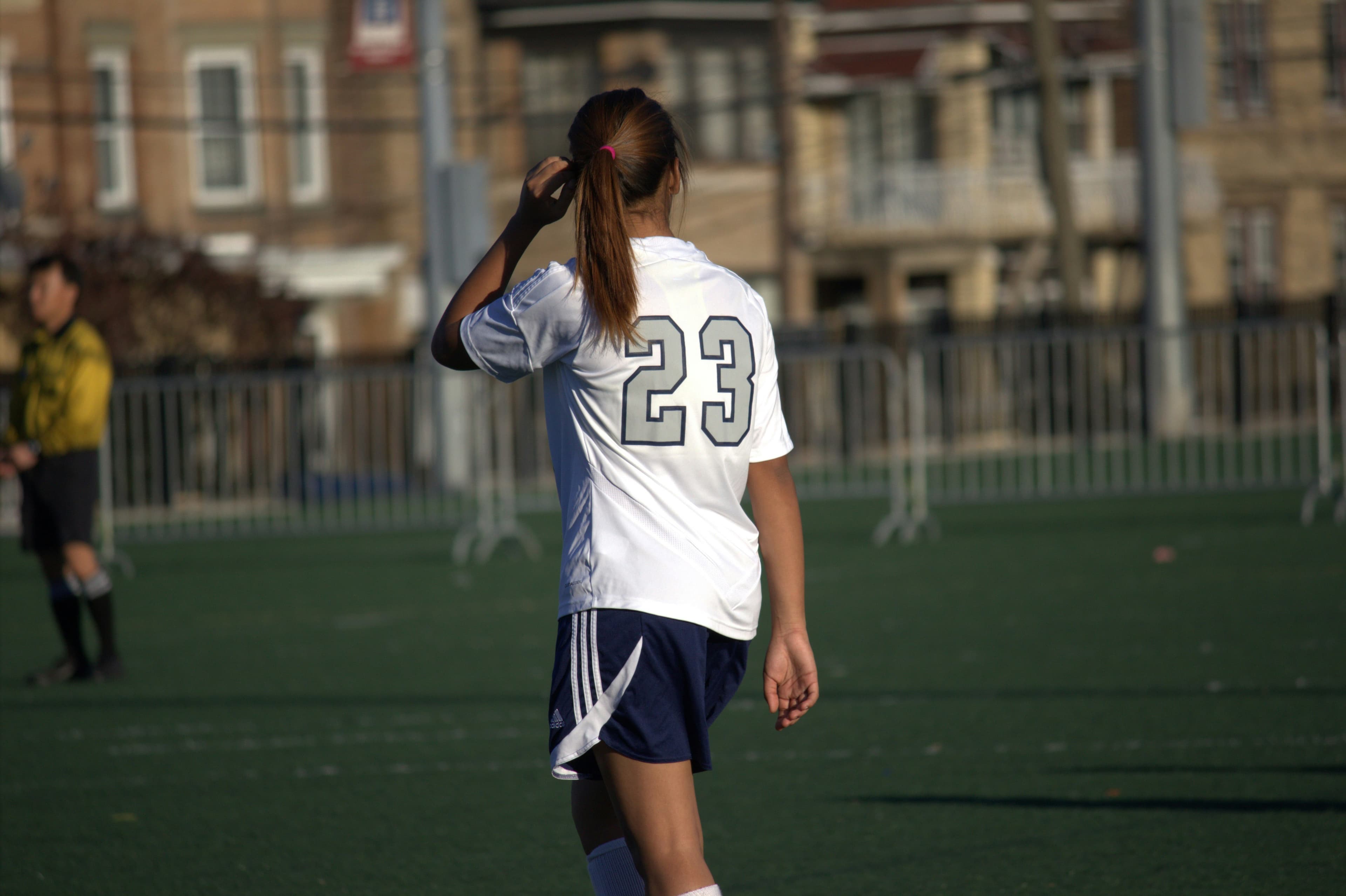 Female high school soccer athlete playing during tournament