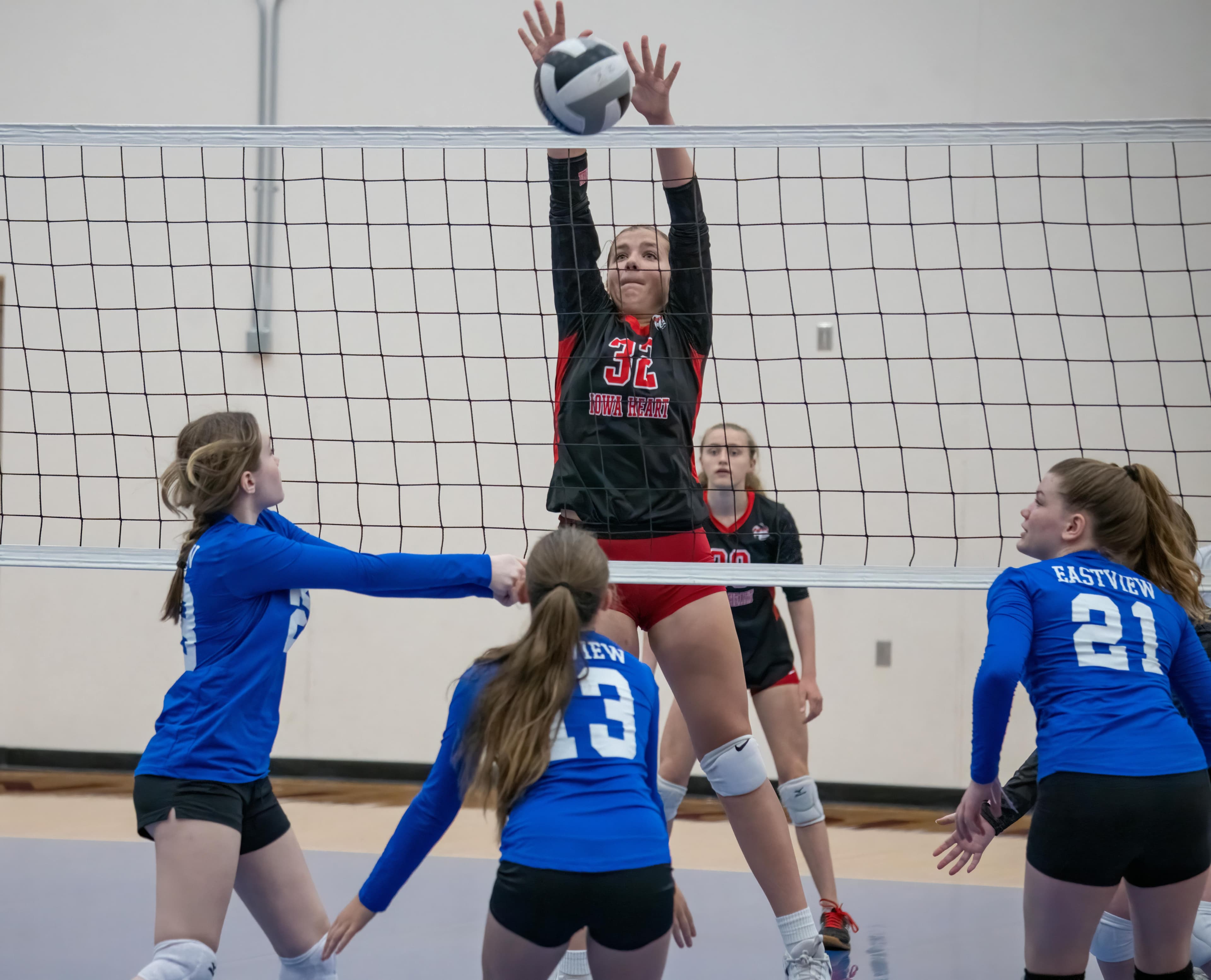 High school girls volleyball team competing in championship match